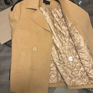 Tan double breasted pea coat.